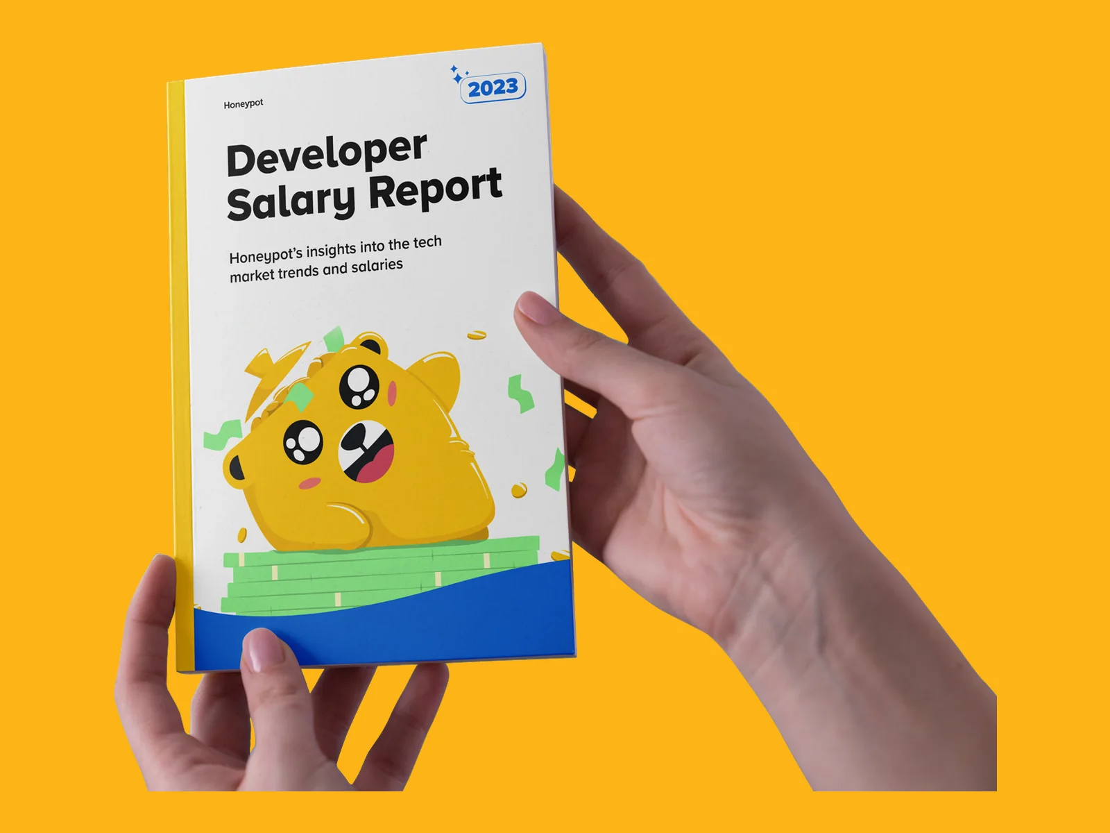 Salary Report 2023, printed, held in hand